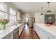Well-lit kitchen with white cabinets, stainless steel appliances, and seamless counter tops at 5525 Alpine Dr, Summerville, SC 29483