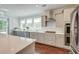 Bright kitchen featuring stone countertops, stainless steel appliances, and a white subway tile backsplash at 5525 Alpine Dr, Summerville, SC 29483