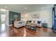 Spacious living room featuring hardwood floors, comfortable seating, and elegant decor at 5525 Alpine Dr, Summerville, SC 29483