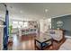 Open-concept living room flowing into the kitchen, with hardwood floors and stylish decor at 5525 Alpine Dr, Summerville, SC 29483