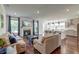 Spacious living room featuring a fireplace, hardwood floors, and an open layout to the kitchen at 5525 Alpine Dr, Summerville, SC 29483