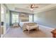 Serene main bedroom with tray ceiling, neutral tones, and large windows at 5525 Alpine Dr, Summerville, SC 29483