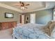 Spacious main bedroom featuring a tray ceiling, dresser, and ensuite bathroom at 5525 Alpine Dr, Summerville, SC 29483