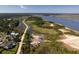 Aerial view featuring boat storage, marshland, and a beautiful view of the waterway beyond at 601 King Haven Ln, Johns Island, SC 29455