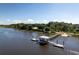 Overhead view of a pier extending into calm waters with docks and coastal foliage at 601 King Haven Ln, Johns Island, SC 29455