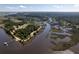 Expansive aerial shot highlights the serene waterfront location, natural beauty, and proximity to the community at 601 King Haven Ln, Johns Island, SC 29455