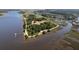 Gorgeous aerial view showcases the waterfront property and surrounding natural landscape near the desirable community at 601 King Haven Ln, Johns Island, SC 29455