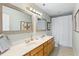 Bright bathroom featuring double sinks, granite countertop, framed mirrors and shower and tub at 601 King Haven Ln, Johns Island, SC 29455