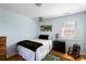 Well-lit bedroom with a twin bed, wood floors, and a charming accent chair at 601 King Haven Ln, Johns Island, SC 29455