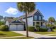 Charming two-story home featuring a two-car garage, inviting front porch, and well-manicured lawn at 601 King Haven Ln, Johns Island, SC 29455