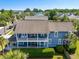 Stunning two-story home showcases a balcony, inviting front porch, and lush landscaping at 601 King Haven Ln, Johns Island, SC 29455