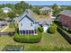 Aerial view of a charming home with a screened porch, two-car garage, and beautifully maintained yard at 601 King Haven Ln, Johns Island, SC 29455