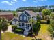 An appealing two-story house with a front porch, a two-car garage, and a lush green yard at 601 King Haven Ln, Johns Island, SC 29455