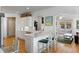 Bright kitchen with white cabinets, stainless steel appliances, white countertops, and views to the living area at 601 King Haven Ln, Johns Island, SC 29455