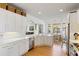 Spacious kitchen with stainless steel appliances, white cabinets, white countertops, and hardwood floors at 601 King Haven Ln, Johns Island, SC 29455