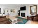 Inviting living room offers a fireplace, TV, and access to the kitchen and dining areas at 601 King Haven Ln, Johns Island, SC 29455