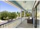 Second story porch featuring a comfortable seating area and a beautiful view of the neighborhood street at 601 King Haven Ln, Johns Island, SC 29455