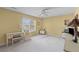 Cozy bedroom with natural light, a ceiling fan, and ample space for work and relaxation at 6242 Fieldstone Cir, Charleston, SC 29414