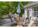 Outdoor dining area on the deck features a sleek glass table at 6242 Fieldstone Cir, Charleston, SC 29414