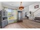 Well-lit dining room with hardwood floors, staircase, and stained glass lighting at 6242 Fieldstone Cir, Charleston, SC 29414