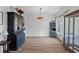 Well-lit dining room with wooden floors and wainscoting at 6242 Fieldstone Cir, Charleston, SC 29414