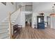 Bright foyer featuring hardwood floors, staircase, and high ceilings at 6242 Fieldstone Cir, Charleston, SC 29414