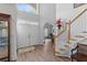 Bright entryway featuring hardwood floors, staircase, and natural light at 6242 Fieldstone Cir, Charleston, SC 29414