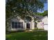 Charming single-Gathering home featuring a manicured lawn, an American flag, and a two-car garage at 6242 Fieldstone Cir, Charleston, SC 29414