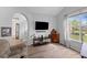 Comfortable living room featuring a large window and a TV at 6242 Fieldstone Cir, Charleston, SC 29414