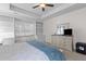 View of the primary bedroom showcasing a window bench, a dresser and mirror, and a ceiling fan at 6242 Fieldstone Cir, Charleston, SC 29414