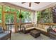 Relaxing screened patio features comfortable seating and natural light at 6242 Fieldstone Cir, Charleston, SC 29414