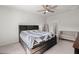 Bright bedroom features a bed with storage, ceiling fan, and a cozy seating area at 630 Jancus St, Charleston, SC 29414