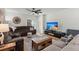 Comfortable living room with a plush sofa, stylish rug, large TV, and great ceiling fan at 630 Jancus St, Charleston, SC 29414