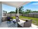 Covered patio with outdoor seating, a rug, and a view of the fenced backyard, perfect for relaxation and entertainment at 630 Jancus St, Charleston, SC 29414