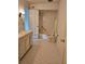 Traditional bathroom featuring white tiled walls, shower/tub combo and hexagon tile flooring at 70 Legare St, Charleston, SC 29401