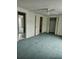 Bedroom with carpet, closet and doorway leading into the bathroom at 70 Legare St, Charleston, SC 29401