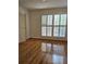 Bright bedroom features hardwood floors, plantation shutters, and ample natural light at 70 Legare St, Charleston, SC 29401