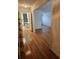 Inviting entryway with hardwood floors, leading to kitchen and living areas at 70 Legare St, Charleston, SC 29401