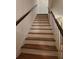 Staircase features hardwood treads, white risers and banisters at 70 Legare St, Charleston, SC 29401