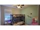 Bedroom featuring a bunk bed, ceiling fan and decorative wall art at 7019 Lanier St, Hanahan, SC 29410