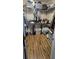 Walk-in closet featuring shelving, laminate wood floors and ample storage at 7019 Lanier St, Hanahan, SC 29410