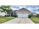 Attractive single-story home featuring a two-car garage and well-kept landscaping at 7019 Lanier St, Hanahan, SC 29410