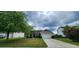 Charming single Gathering home with manicured lawn and a two-car garage at 7019 Lanier St, Hanahan, SC 29410