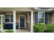 Inviting front porch with seating, decorative columns, and a welcoming entrance at 7019 Lanier St, Hanahan, SC 29410