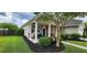 Cozy front porch with white columns, comfortable seating, and a relaxing hammock at 7019 Lanier St, Hanahan, SC 29410