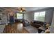 Comfortable living room showcasing a ceiling fan, stylish furniture, and natural light from the windows at 7019 Lanier St, Hanahan, SC 29410