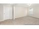 Spacious bedroom with neutral carpeting and a large window offering plenty of natural light at 714 N Hickory St # 13, Summerville, SC 29483