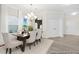 Elegant dining room with modern chandelier, and ample natural light at 714 N Hickory St # 13, Summerville, SC 29483