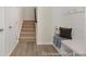 Inviting entryway with a bench, coat hooks, and staircase leading to the upper level at 714 N Hickory St # 13, Summerville, SC 29483