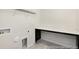 Functional laundry room includes overhead storage and large countertop perfect for folding at 714 N Hickory St # 13, Summerville, SC 29483